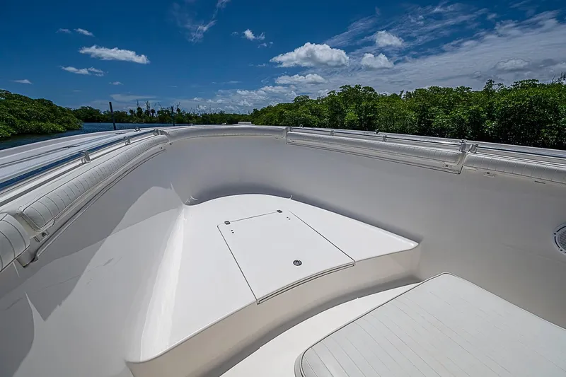 Slide: The Image of 2008 Buddy Davis 34 Center Console boat deck under clear blue sky. - 10