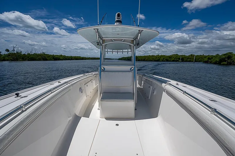 Slide: The Image of 2008 Buddy Davis 34 Center Console boat on calm water under a blue sky. - 12