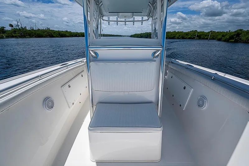Slide: The Image of 2008 Buddy Davis 34 Center Console boat interior with seating, on a calm waterway. - 13