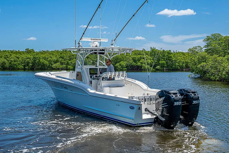 Slide: The Image of 2008 Buddy Davis 34 Center Console boat cruising on a scenic waterway. - 16