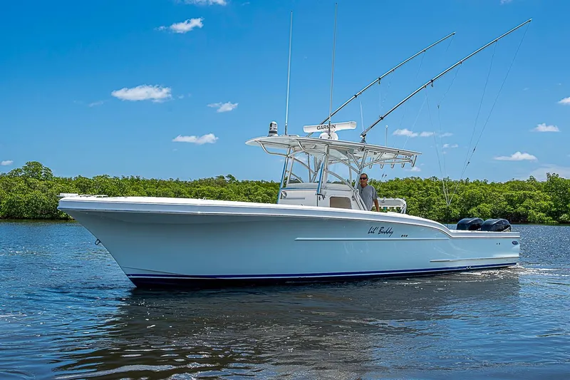 Slide: The Image of 2008 Buddy Davis 34 Center Console boat cruising on a sunny day. - 17
