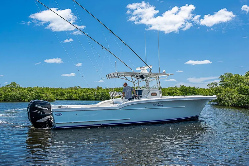 Slide: The Image of 2008 Buddy Davis 34 Center Console boat cruising on a sunny day with clear blue skies. - 19