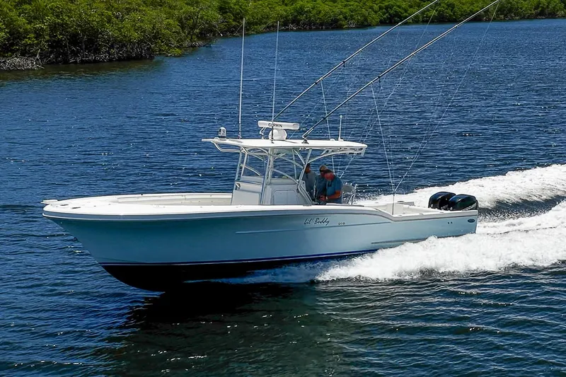 Slide: The Image of 2008 Buddy Davis 34 Center Console boat cruising on blue water. - 21