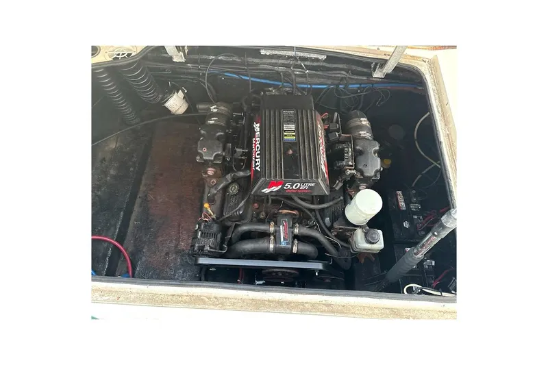 Slide: The Image of Engine compartment of a 2001 Stingray 240 CS boat with Mercury 5.0L engine. - 5