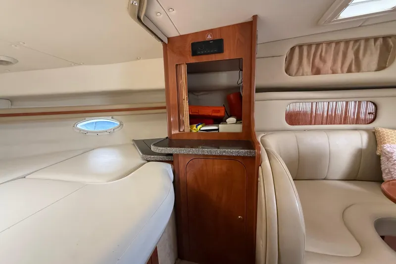 Slide: The Image of 2003 Rinker Fiesta Vee 342 cabin interior with seating and storage. - 18