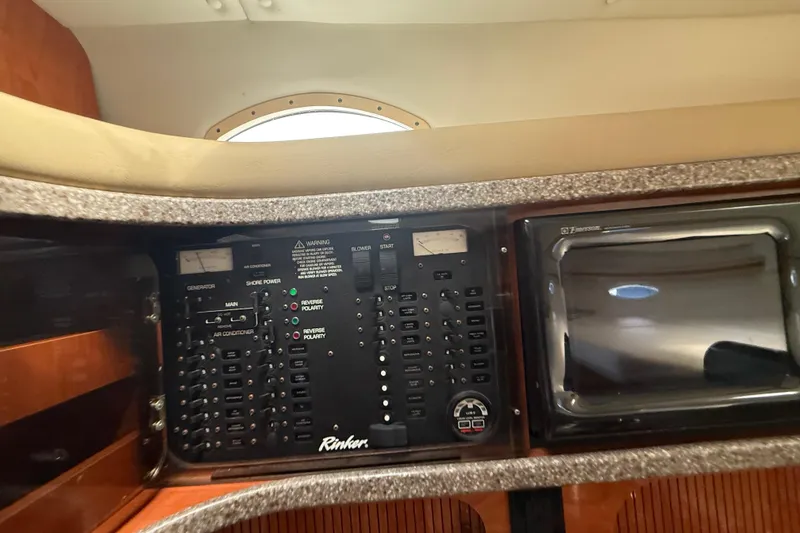 Slide: The Image of Control panel of a 2003 Rinker Fiesta Vee 342 boat interior. - 21