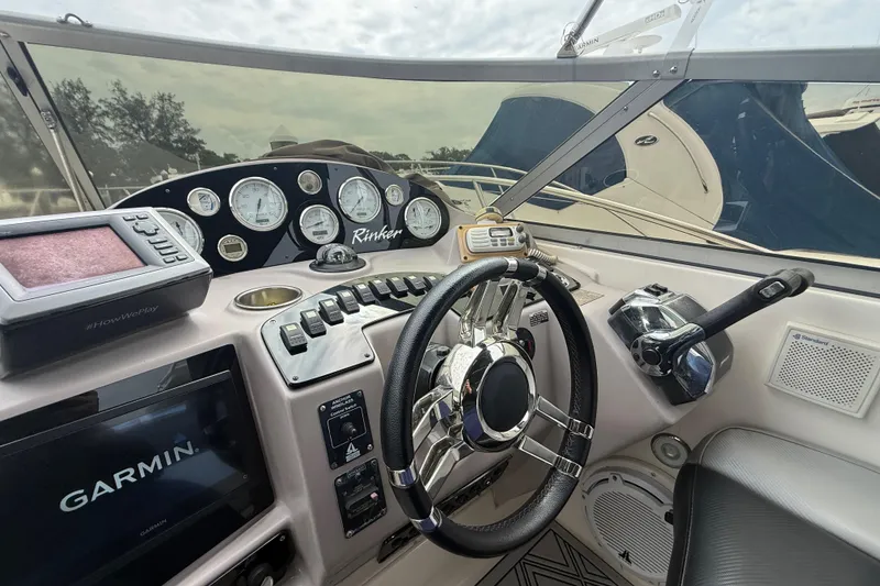 Slide: The Image of Cockpit of 2003 Rinker Fiesta Vee 342 with Garmin navigation system and control panel. - 30