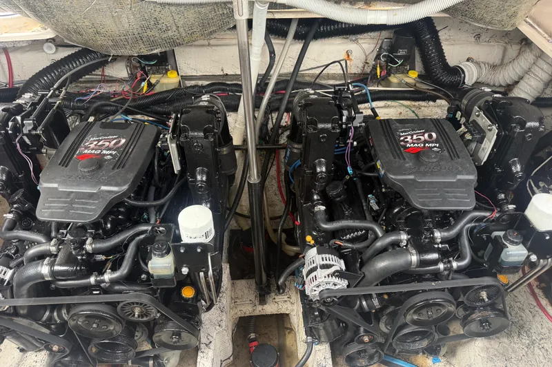 Slide: The Image of Twin MerCruiser 350 MAG MPI engines in a 2003 Rinker Fiesta Vee 342 boat. - 48
