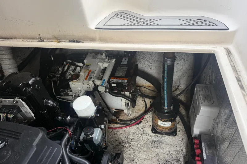 Slide: The Image of Engine compartment of a 2003 Rinker Fiesta Vee 342 boat, showing mechanical components. - 51
