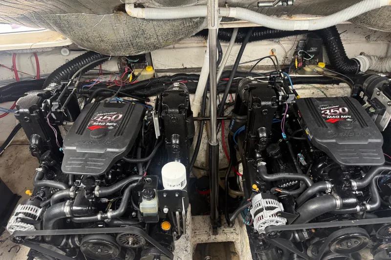 Slide: The Image of Twin MerCruiser 350 MAG MPI engines in a 2003 Rinker Fiesta Vee 342 boat. - 52