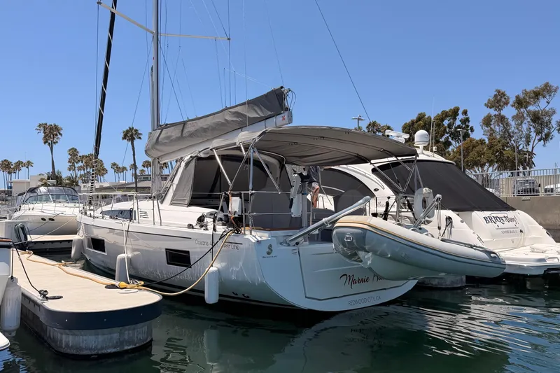 Slide: The Image of 2020 Beneteau Oceanis 46.1 yacht docked at marina under clear blue sky. - 10