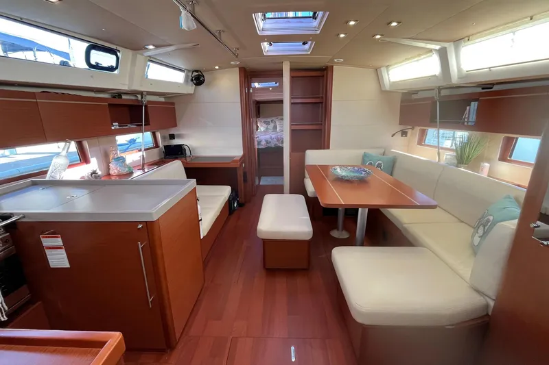 Slide: The Image of Luxurious interior of 2020 Beneteau Oceanis 46.1 yacht with modern seating and dining area. - 17