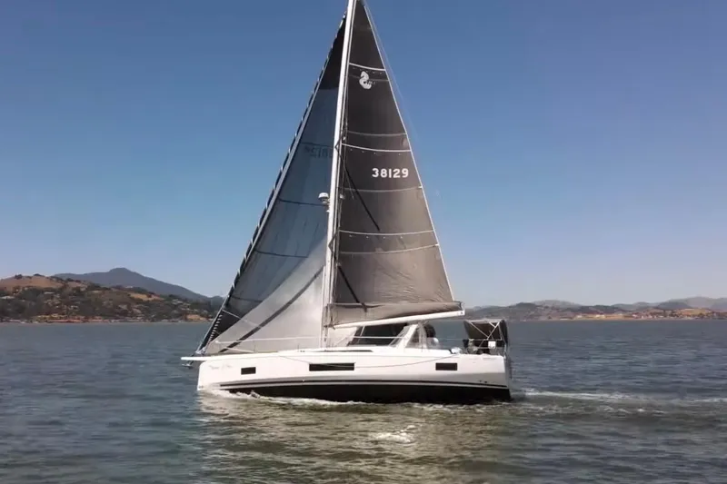 Slide: The Image of 2020 Beneteau Oceanis 46.1 sailing on a calm sea under clear blue skies. - 2