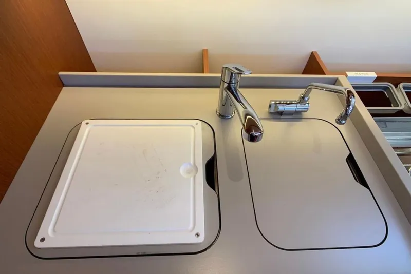 Slide: The Image of Modern kitchen sink area on 2020 Beneteau Oceanis 46.1 yacht. - 21