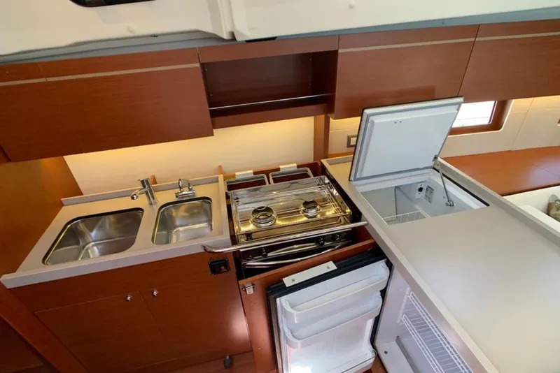 Slide: The Image of Modern kitchen in 2020 Beneteau Oceanis 46.1 yacht with dual sinks and appliances. - 22