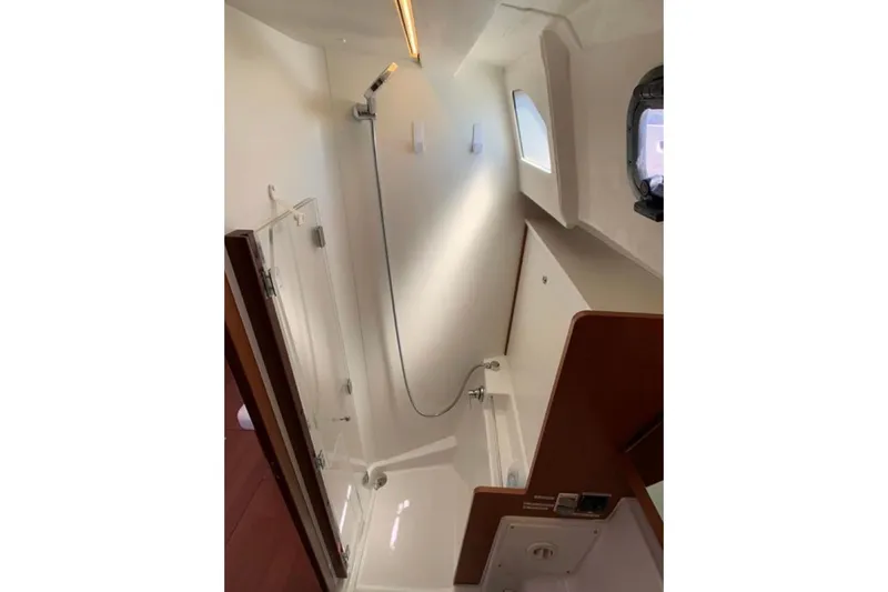Slide: The Image of Interior of 2020 Beneteau Oceanis 46.1 yacht bathroom with shower and window. - 27