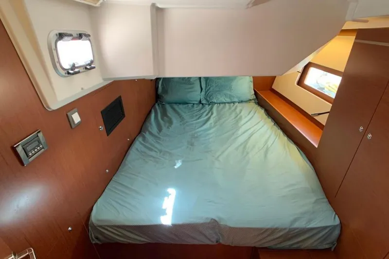 Slide: The Image of Cozy cabin interior of 2020 Beneteau Oceanis 46.1 yacht with comfortable bedding. - 28
