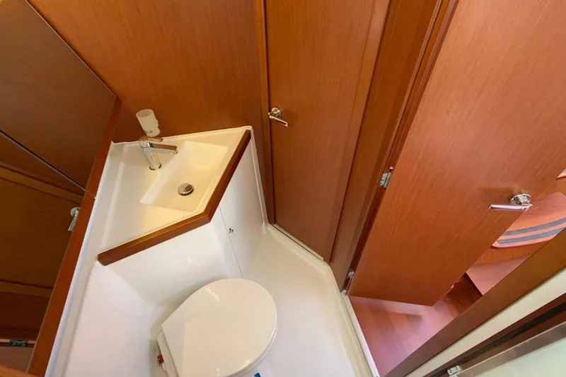 Slide: The Image of Bathroom interior of 2020 Beneteau Oceanis 46.1 yacht, featuring sink and toilet. - 31