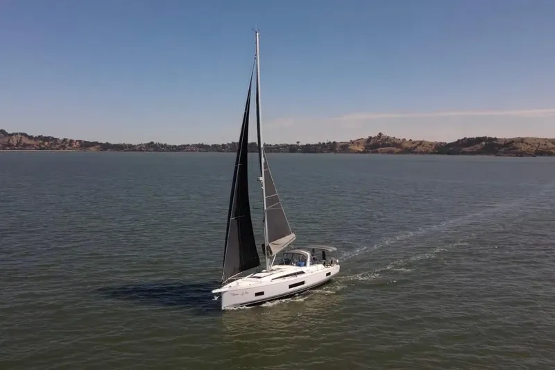 Slide: The Image of 2020 Beneteau Oceanis 46.1 sailing on calm waters under clear skies. - 35