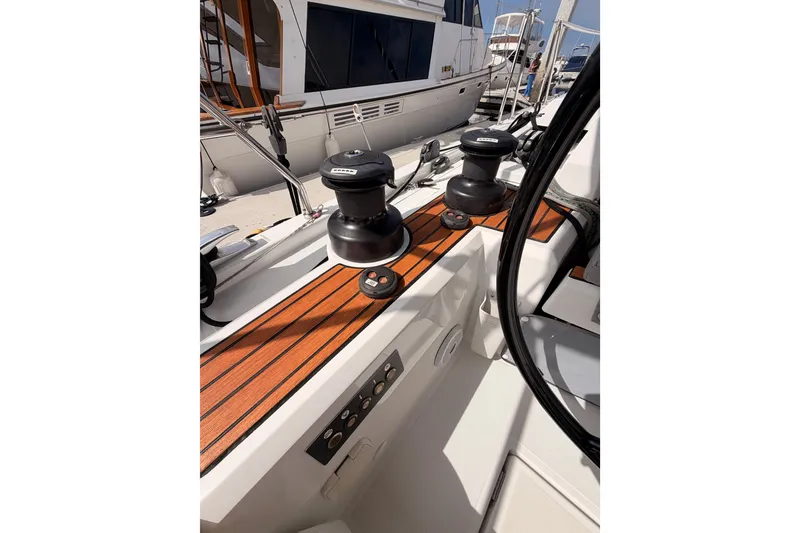 Slide: The Image of Cockpit view of 2020 Beneteau Oceanis 46.1 sailboat with winches and teak decking. - 45
