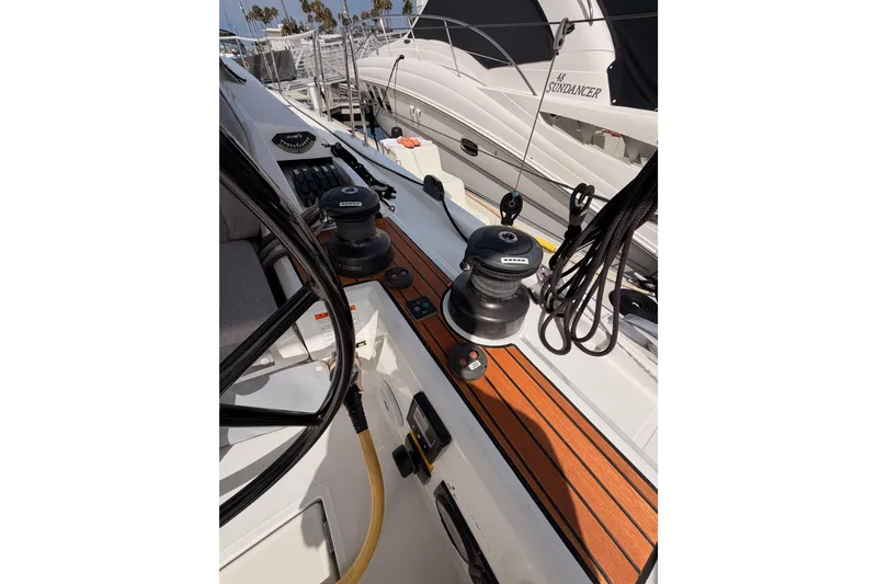 Slide: The Image of 2020 Beneteau Oceanis 46.1 yacht deck with winches and ropes, docked at marina. - 50