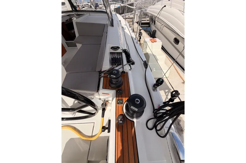 Slide: The Image of 2020 Beneteau Oceanis 46.1 yacht deck with winches and seating area. - 51