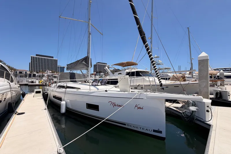Slide: The Image of Beneteau Oceanis 46.1 sailboat docked at marina, 2020 model, clear blue sky. - 6