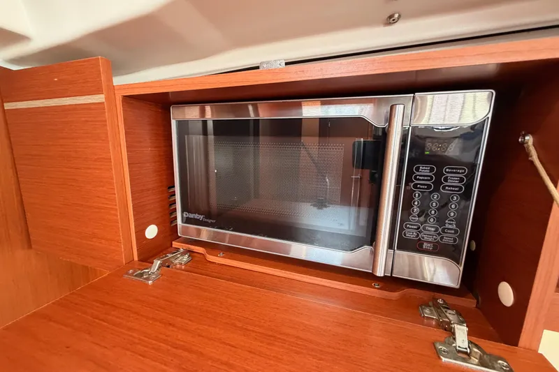Slide: The Image of Microwave in 2020 Beneteau Oceanis 46.1 yacht's wooden cabinet interior. - 66