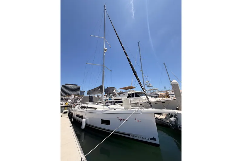 Slide: The Image of 2020 Beneteau Oceanis 46.1 sailboat docked at marina under clear blue sky. - 7