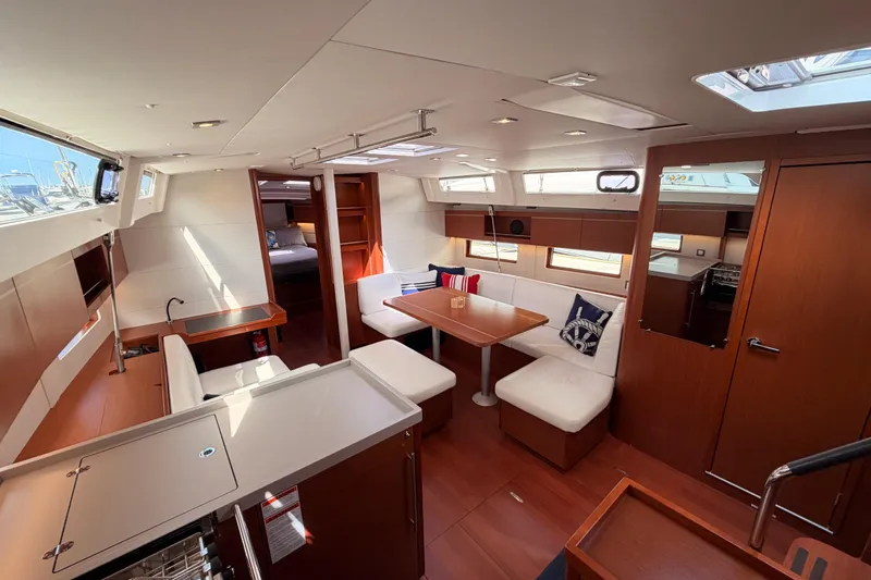 Slide: The Image of Interior of 2020 Beneteau Oceanis 46.1 yacht, featuring modern seating and dining area. - 71