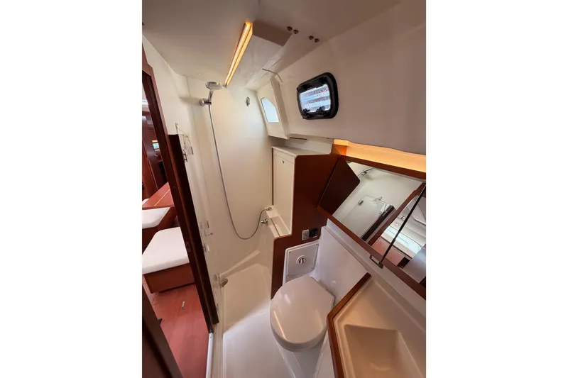 Slide: The Image of Modern bathroom interior of 2020 Beneteau Oceanis 46.1 yacht, featuring shower and toilet. - 74