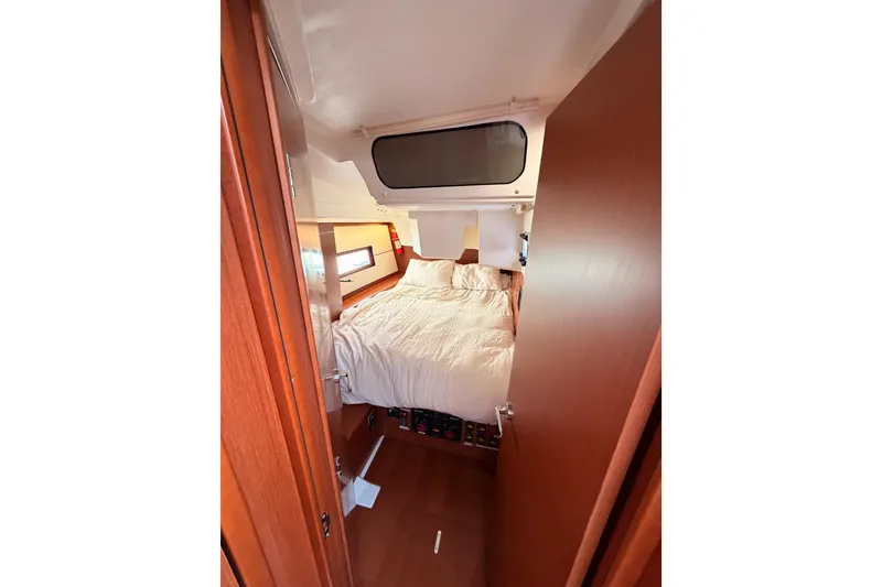 Slide: The Image of Cozy cabin interior of 2020 Beneteau Oceanis 46.1 yacht with comfortable bedding. - 76