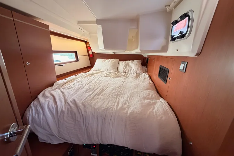 Slide: The Image of Cozy cabin interior of 2020 Beneteau Oceanis 46.1 yacht with comfortable bed. - 77