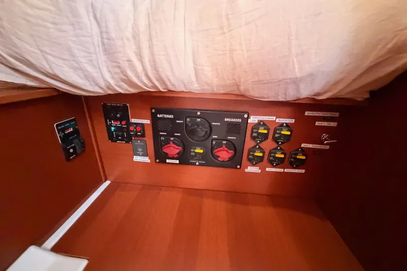 Slide: The Image of Electrical panel on a 2020 Beneteau Oceanis 46.1 yacht, featuring battery and breaker controls. - 78