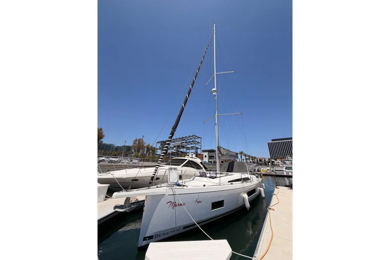 Slide: The Image of 2020 Beneteau Oceanis 46.1 sailboat docked at marina under clear blue sky. - 8