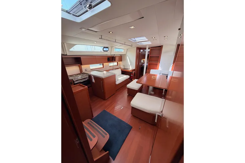 Slide: The Image of Interior of 2020 Beneteau Oceanis 46.1 yacht, featuring elegant wood finishes and modern design. - 81