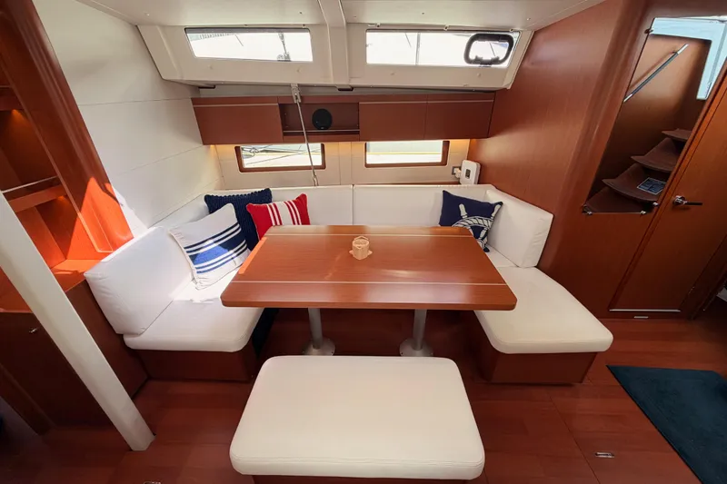 Slide: The Image of Interior of 2020 Beneteau Oceanis 46.1 yacht with cozy seating and nautical decor. - 84