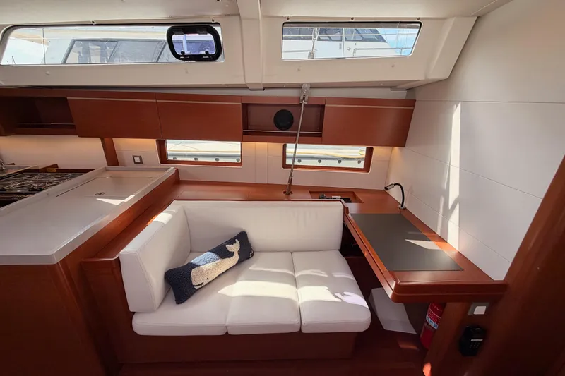 Slide: The Image of Interior of 2020 Beneteau Oceanis 46.1 yacht with modern seating and wooden finishes. - 85