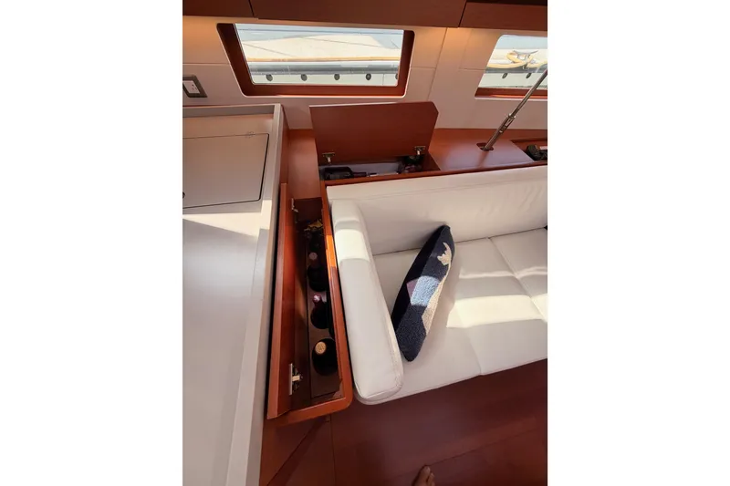 Slide: The Image of Interior of 2020 Beneteau Oceanis 46.1 yacht with white seating and storage. - 86