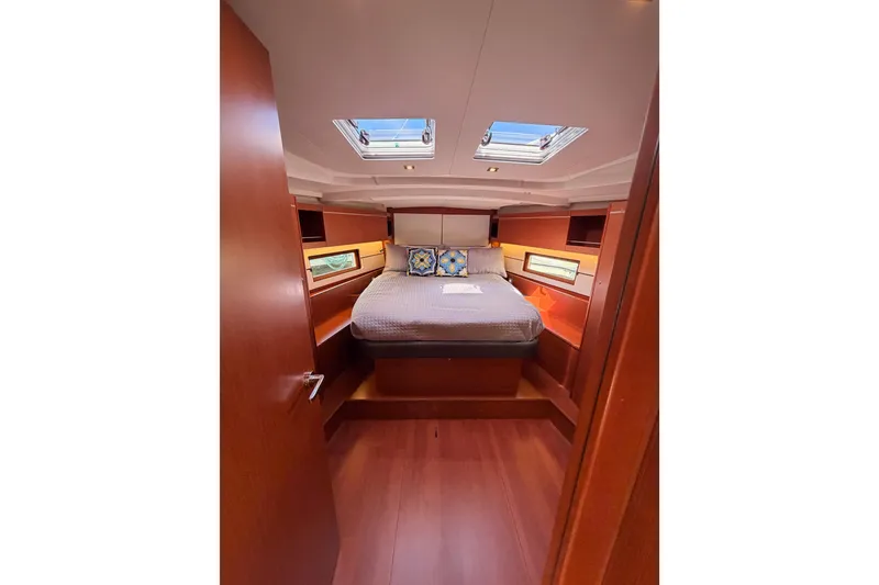 Slide: The Image of Luxurious cabin interior of 2020 Beneteau Oceanis 46.1 yacht with skylights and cozy bedding. - 90