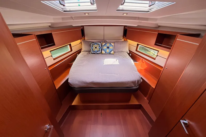 Slide: The Image of Luxurious cabin interior of 2020 Beneteau Oceanis 46.1 yacht with cozy bedding. - 91