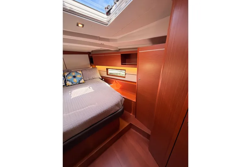 Slide: The Image of Luxurious cabin interior of 2020 Beneteau Oceanis 46.1 yacht with skylight and cozy bedding. - 93