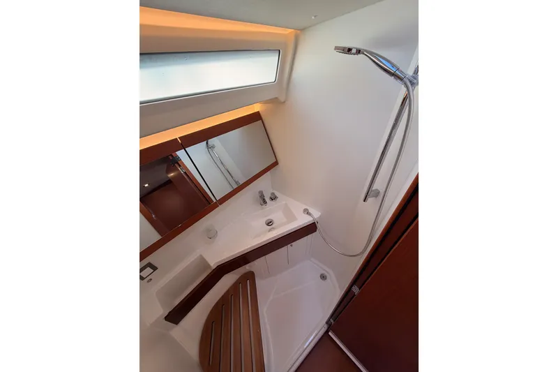 Slide: The Image of Modern bathroom interior on 2020 Beneteau Oceanis 46.1 yacht, featuring sleek shower and mirror. - 94