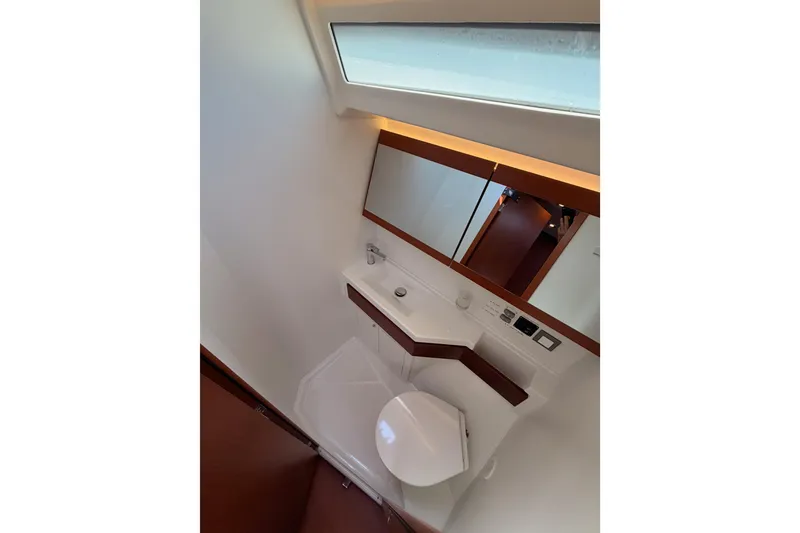 Slide: The Image of Bathroom interior of 2020 Beneteau Oceanis 46.1 yacht, featuring modern fixtures and mirror. - 96