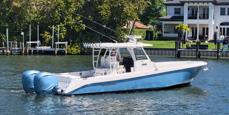 Slide: The Image of 2024 Everglades 365 Center Console boat on a scenic waterway. - 1
