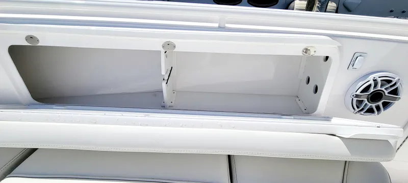 Slide: The Image of 2024 Everglades 365 Center Console boat storage compartment with speaker detail. - 11