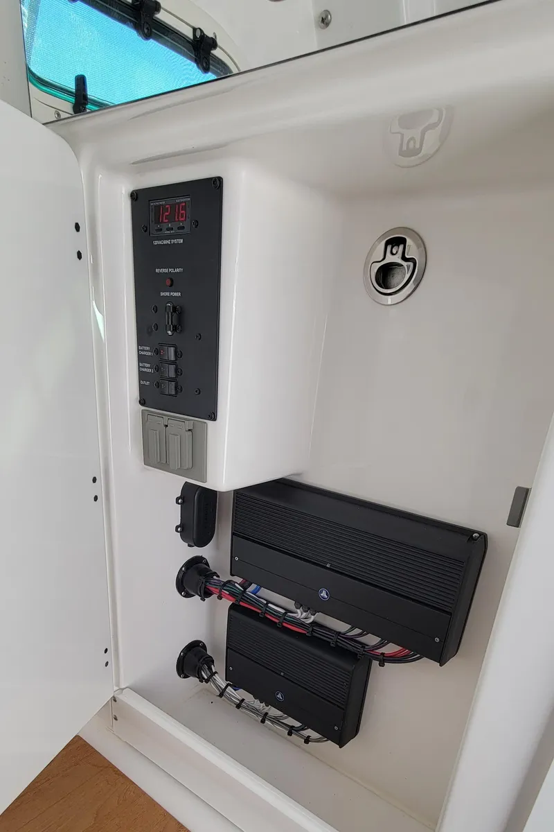 Slide: The Image of 2024 Everglades 365 Center Console electrical panel with wiring and components. - 21