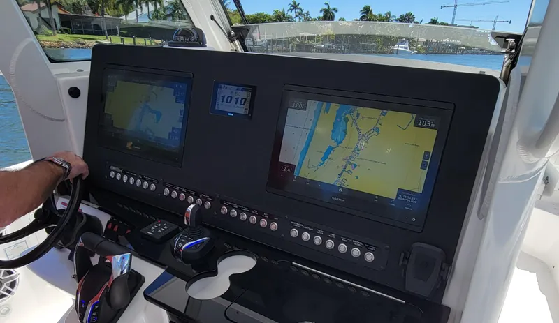 Slide: The Image of 2024 Everglades 365 Center Console dashboard with navigation screens and controls. - 6