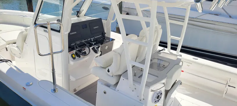 Slide: The Image of 2024 Everglades 365 Center Console boat interior with helm and seating. - 7