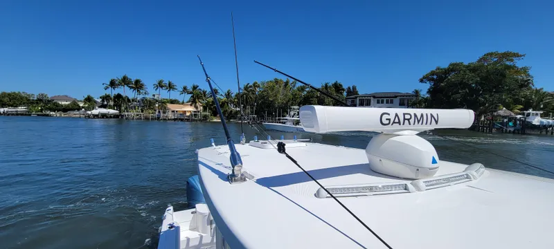 Slide: The Image of 2024 Everglades 365 Center Console boat with Garmin radar on calm waters. - 9